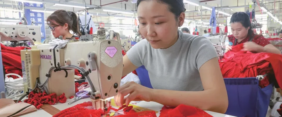 Employees work at a textile manufacturing workshop in Qiandongnan Miao and Dong Autonomous Prefecture, Guizhou Province, China, on June 28, 2026. (Photo: VCG)